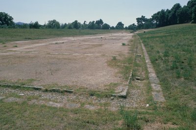 Running track and water channel, providing refreshment for spectators, in the stadium by Greek